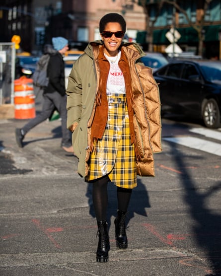 Tamu McPherson is seen wearing a parka, yellow checkered skirt outside Sies Marjan during New York fashion week Fall/Winter