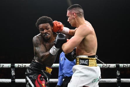 Tim Tszyu strikes Errol Spence Jr during their bout.
