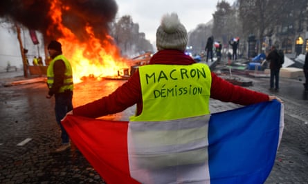 The ‘gilets jaunes’ protest against rising fuel prices in Paris, 24 November.