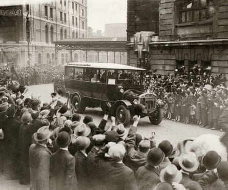 The Australian cricket team, greeted by huge crowds, are driven away from Victoria Station in April 1926.