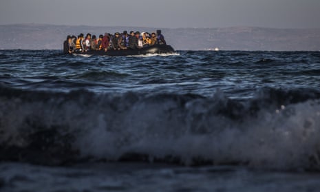 Refugees and migrants in a dinghy approaching the Greek island of Lesbos