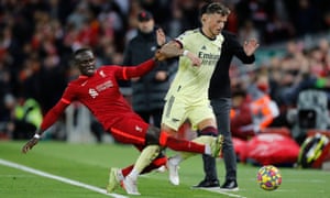 Liverpool’s Sadio Mane fouls Arsenal’s Ben White before receiving a yellow card.