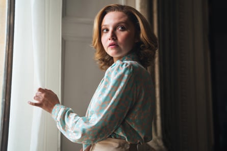 Jane played by Mia McKenna-Bruce stood by a window.