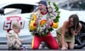 Josef Newgarden celebrates with his son Kota and wife Ashley Welch after winning the Indianapolis 500