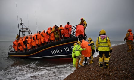 A RNLI lifeboat helps people who were attempting to cross the Channel, at Dungeness in south-east England, on 9 December 2022.