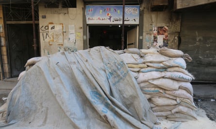 Sandbags protect the entrance of a children’s hospital in Aleppo.