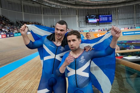 Neil Fachie (right) and pilot Aaron Pope of Scotland celebrate their victory with the Saltire.