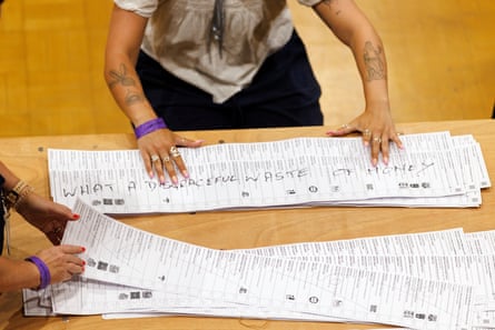 Election workers sort through spoilt ballots at Clacton Leisure Centre.