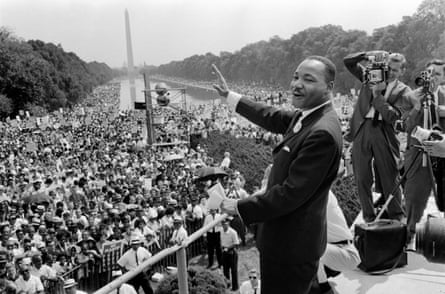 US civil rights leader Martin Luther King (C) waves to supporters 28 August 1963 on the Mall in Washington DC.
