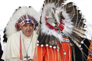 Pope Francis wears a traditional headdress he was given after his apology to Indigenous people during a ceremony in Maskwacis, Canada
