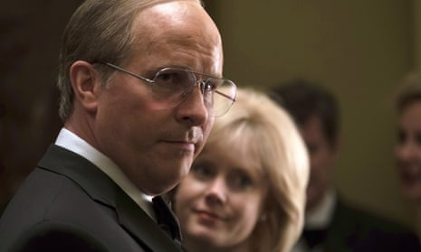 Christian Bale as Dick Cheney, with Amy Adams as Lynne Cheney behind