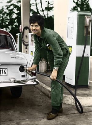 An employee at a BP petrol station in Germany refueing a car in 1961