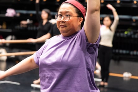 A woman with a bemused expression in an adult’s ballet class.