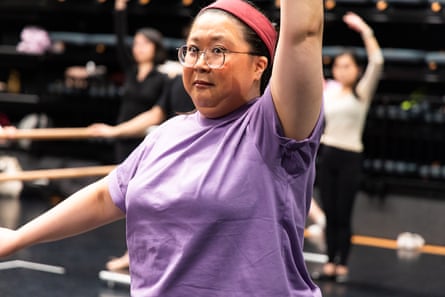A woman with a bemused expression in an adult’s ballet class.