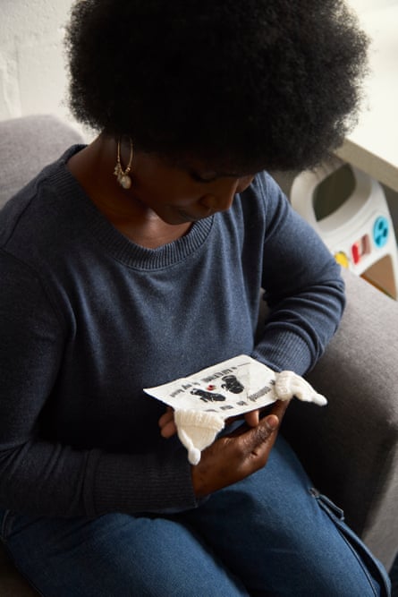 Ernesta Chirwa holds mementos gifted to her and her husband, Cifundo Bingala, after the loss of their twins.