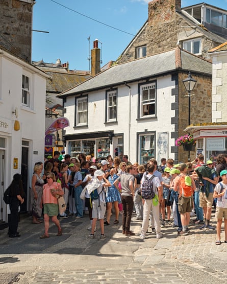Holidaymakers in the streets of St Ives, Cornwall, UK, July 2024