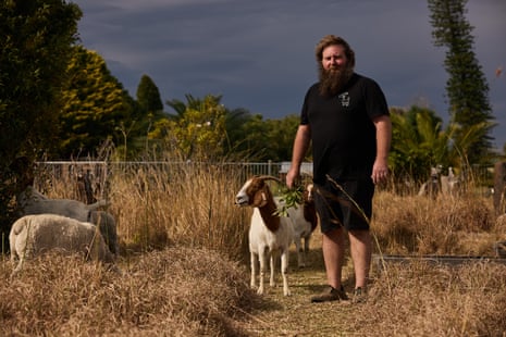 Craig Homan, from Sydney Eco Land Clearing, at Rookwood Cemetery with his goats and sheep that are being used to naturally clear the land of weeds