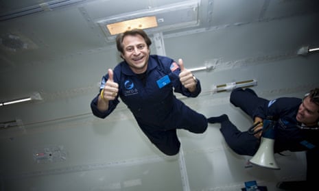 peter diamandis gives the thumbs up while floating in simulated zero gravity