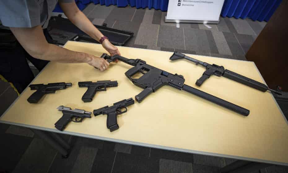 Royal Canadian Mounted Police display seized firearms in Surrey, British Columbia, last year.