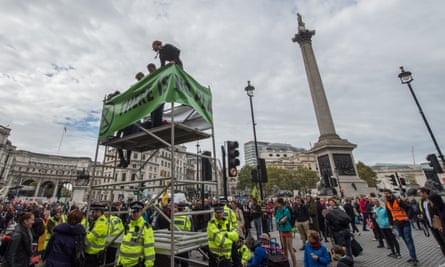 Activists erect a mobile scaffold in Trafalgar Square