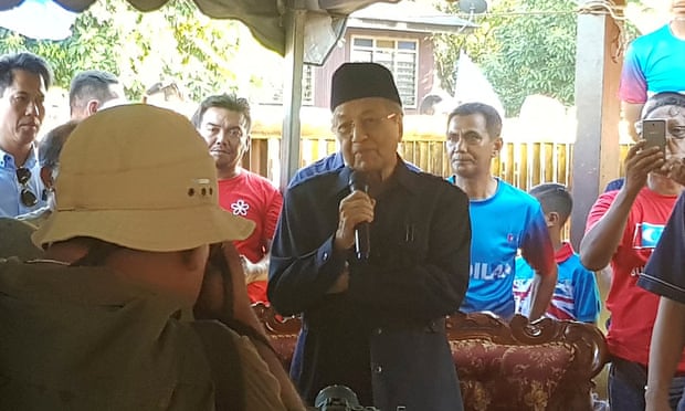 Malaysia’s opposition leader Mahathir Mohamad speaks to people at the Bukit Goh Felda settlement in Pahang