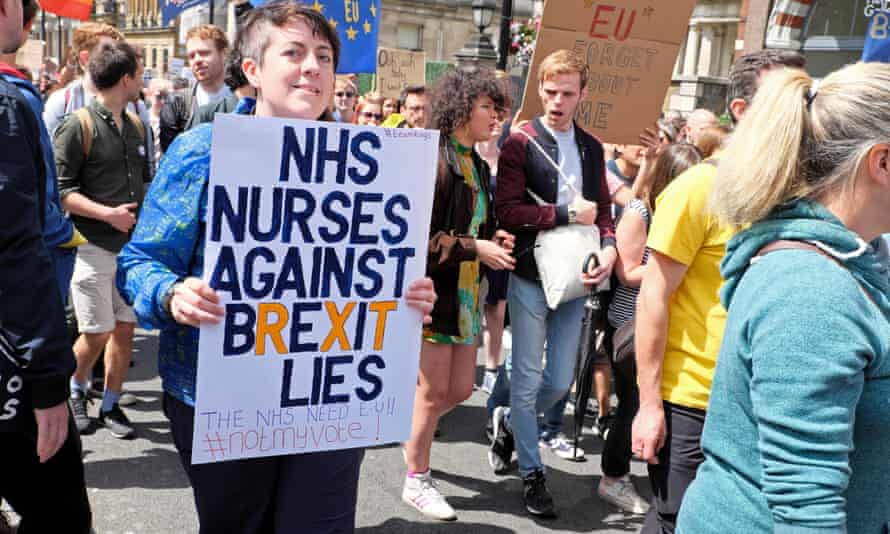 A nurse holds a poster saying “NHS nurses against Brexit lies” at a protest in London in 2016