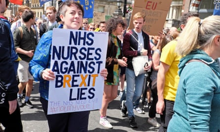 A nurse holds a poster saying “NHS nurses against Brexit lies” at a protest in London in 2016