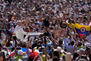Pope Leo XIV waves as he is driven through the crowds in St Peter’s Square