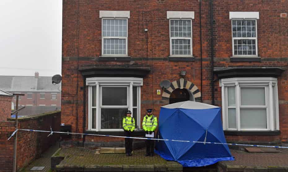 Police outside a house in Stafford being searched following the attacks in London. 