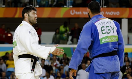 Islam El Shehaby, in blue, declines to shake hands with Israel’s Or Sasson at the end of their bout