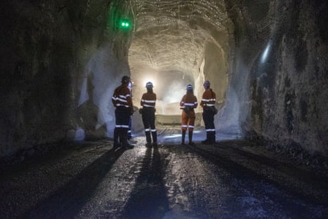 Workers at the crusher dump pocket in a working shaft off the main decline portal of Newcrest’s Cadia East Gold Mine, Australia
