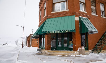 Drug store on snowy street