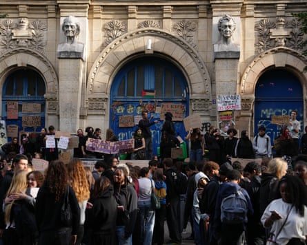 Students block the entrance of the Voltaire high school in Paris.