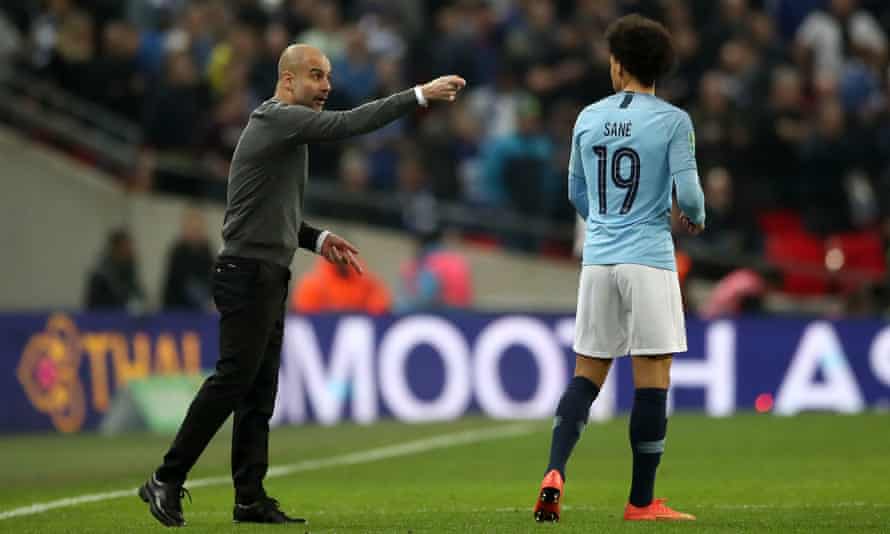 Pep Guardiola instructs Leroy Sané during a match