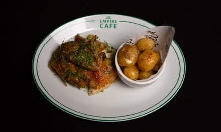 ‘The schmaltz dripping into the roasting potatoes below’: half rotisserie chicken with garlic, lemon and tarragon sauce.