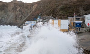 Storm watchers at Trevaunance Cove as Storm Eunice hits St Agnes in Cornwall. Photo by Jonny Weeks/The Guardian