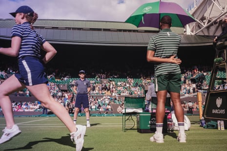 Ball girls and ball boys on duty courtside