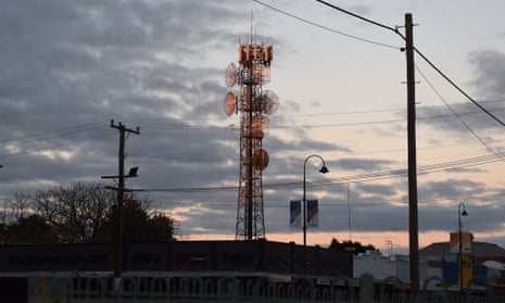 A communications tower is seen at sunset in the NSW outback