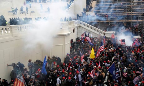 Police use teargas against a crowd of pro-Trump protesters during the attack on the US Capitol on 6 January.