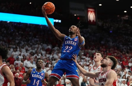 The Kansas guard, Darryn Peterson, shoots during the first half of an NCAA college basketball game against Arizona.