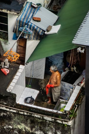 A man doing chores on a rooftop in Tai Hang neighborhood where I lived. Nearly one in five people live in poverty in the city, which is one of the world’s most unequal places to live.