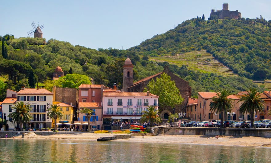 beach, pretty town and green hills