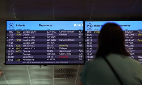 A departure board at Ferenc Liszt international airport in Budapest shows delays and cancellations to UK-bound flights