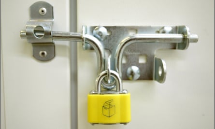 A bolt and padlock on a self-storage unit