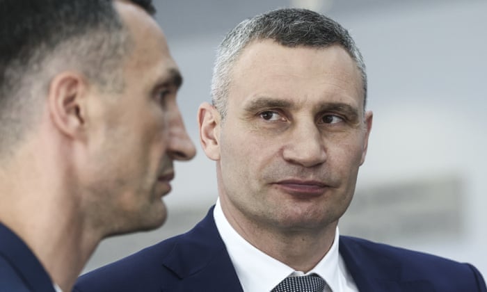 Brothers Vitali Klitschko (centre) and Wladimir Klitschko (left) are seen during the NATO Summit at the IFEMA congress centre NATO Summit, Madrid, Spain on 29 June 2022.