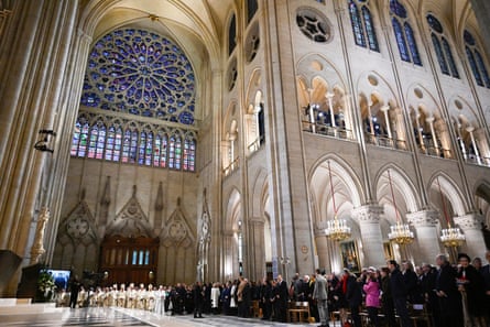 Dramatic view of one of the huge circular stained glass windows of the cathedral, seen as it were form a sitting position near the central aisle