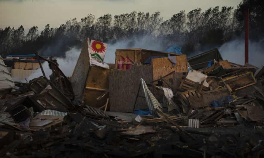 Destroyed tents and structures in the camp.