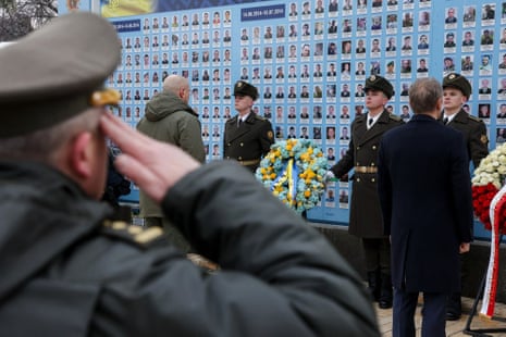 Ukraine’s Prime Minister Denys Shmyhal and Poland’s Prime Minister Donald Tusk (R) attend a wreath-laying ceremony at The Wall of Remembrance of the Fallen for Ukraine in Kyiv.