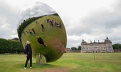 Anish Kapoor with his sculpture Sky Mirror, at Houghton Hall, Norfolk
