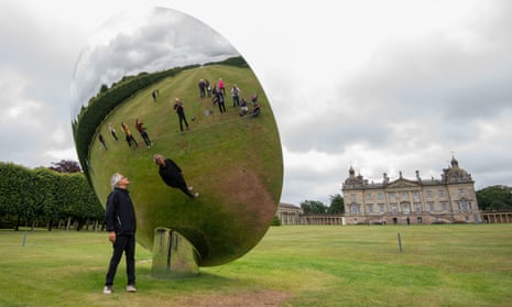 Anish Kapoor with his sculpture Sky Mirror, at Houghton Hall, King’s Lynn, Norfolk